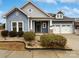 Two-story house with blue siding, stone accents, and a three-car garage at 1924 Felts Pkwy, Fort Mill, SC 29715