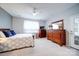 Spacious bedroom with a dresser and access to patio at 201 Picasso Trl, Mount Holly, NC 28120