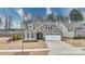 Charming craftsman style home with stone accents and a two-car garage at 201 Picasso Trl, Mount Holly, NC 28120