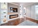 Modern electric fireplace with built-in shelving on either side at 201 Picasso Trl, Mount Holly, NC 28120