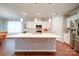 Modern kitchen with white cabinets, stainless steel appliances, and large island at 201 Picasso Trl, Mount Holly, NC 28120