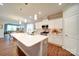 Modern kitchen with white cabinets, stainless steel appliances, and large island at 201 Picasso Trl, Mount Holly, NC 28120