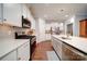 Modern kitchen with white cabinets and stainless steel appliances at 201 Picasso Trl, Mount Holly, NC 28120