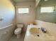 Bathroom featuring a toilet, sink and a mirror at 202 Cedar St, Belmont, NC 28012