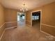 Dining room with beige walls, stained carpet and a chandelier at 202 Cedar St, Belmont, NC 28012