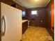 Kitchen with a white refrigerator, wood cabinets, and a window at 202 Cedar St, Belmont, NC 28012