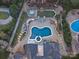 Aerial view of a backyard oasis featuring a pool, hot tub, and outdoor entertaining area at 209 Choate Ave, Fort Mill, SC 29708