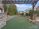 Backyard with a putting green, stone accents, and a pergola for shaded relaxation at 209 Choate Ave, Fort Mill, SC 29708