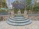 Beautiful backyard showcases a multi-tiered landscape design with stone steps and pillars at 209 Choate Ave, Fort Mill, SC 29708