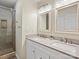 Bright bathroom with double sinks, a large mirror, and a glass-enclosed tiled shower at 209 Choate Ave, Fort Mill, SC 29708