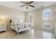 Cozy bedroom with hardwood floors and bright windows with an ornate white metal bed frame at 209 Choate Ave, Fort Mill, SC 29708