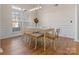 Elegant dining room with wainscoting, chandelier, and large windows for natural light at 209 Choate Ave, Fort Mill, SC 29708