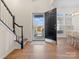 Inviting foyer with hardwood floors, staircase, and an open view into the dining area at 209 Choate Ave, Fort Mill, SC 29708