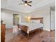 Spacious main bedroom features wood floors, ceiling fan, tray ceiling, and an ensuite bathroom at 209 Choate Ave, Fort Mill, SC 29708