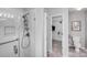 Bright bathroom boasts a glass-enclosed shower, toilet and access to a walk-in closet at 2213 Genesis Dr, Monroe, NC 28110