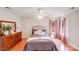 Bright bedroom with hardwood floors, a ceiling fan, a large window, and neutral walls at 2213 Genesis Dr, Monroe, NC 28110