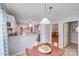 Open dining area with hardwood floors and views into the living room at 2213 Genesis Dr, Monroe, NC 28110