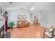 Inviting living room featuring hardwood floors, a neutral color scheme, and a comfortable seating area at 2213 Genesis Dr, Monroe, NC 28110