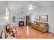 Spacious living room with vaulted ceiling, fireplace, and stylish furnishings creates a relaxing atmosphere at 2213 Genesis Dr, Monroe, NC 28110