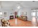 Open-concept living area boasting a fireplace, ample natural light, and a neutral color palette at 2213 Genesis Dr, Monroe, NC 28110