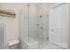 Contemporary shower with glass enclosure and a built-in bench at 2218 Croydon Rd, Charlotte, NC 28207