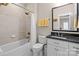 Clean bathroom featuring a shower-tub combination and granite vanity with great lighting at 2218 Croydon Rd, Charlotte, NC 28207