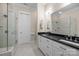 Modern bathroom featuring a double vanity, granite countertop, and glass shower at 2218 Croydon Rd, Charlotte, NC 28207