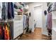 Walk-in closet with custom shelving and hardwood floors at 2218 Croydon Rd, Charlotte, NC 28207