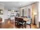 Bright dining area connecting to the kitchen, featuring hardwood floors and natural light at 2218 Croydon Rd, Charlotte, NC 28207