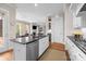 Open-concept kitchen featuring stainless steel appliances and a view into the living area at 2218 Croydon Rd, Charlotte, NC 28207