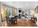 Open-concept living space with hardwood floors, dining area, and cozy seating at 2218 Croydon Rd, Charlotte, NC 28207