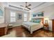 Spacious main bedroom with a tray ceiling, hardwood floors, and ample natural light at 2218 Croydon Rd, Charlotte, NC 28207