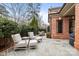 Cozy back patio area with comfortable outdoor seating and elegant stonework at 2218 Croydon Rd, Charlotte, NC 28207