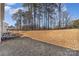 Spacious backyard with sloped terrain and mature trees providing privacy at 232 Morgans Branch Rd, Belmont, NC 28012