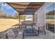 Relaxing backyard patio with covered seating area, perfect for outdoor entertaining at 232 Morgans Branch Rd, Belmont, NC 28012