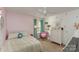 Playful bedroom with pink walls and colorful bedding at 232 Morgans Branch Rd, Belmont, NC 28012