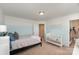 Serene bedroom with light blue walls and a crib at 232 Morgans Branch Rd, Belmont, NC 28012