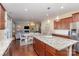 Open kitchen with island, granite counters, and views into Gathering room at 232 Morgans Branch Rd, Belmont, NC 28012