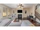 Spacious living room with hardwood floors, fireplace, and L-shaped sofa at 232 Morgans Branch Rd, Belmont, NC 28012