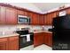 Modern kitchen featuring wood cabinets, stainless steel appliances, and ample counter space at 234 Henson Ln, McConnells, SC 29726