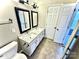 Double vanity bathroom with a quartz countertop and tiled floor at 2711 Thornbush Ct, Charlotte, NC 28270