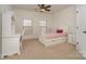 Charming bedroom with a desk, bright natural light, and neutral carpet, perfect for study and relaxation at 3013 Misty Moss Ct, Waxhaw, NC 28173