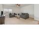 Cozy bonus room with neutral carpeting, ceiling fan and comfortable seating for Gathering and friends at 3013 Misty Moss Ct, Waxhaw, NC 28173