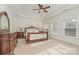 Spacious main bedroom featuring tray ceiling, ceiling fan, carpeting and bright natural light at 3013 Misty Moss Ct, Waxhaw, NC 28173