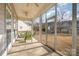 Inviting screened porch with green outdoor furniture, offering a relaxing outdoor living space at 3013 Misty Moss Ct, Waxhaw, NC 28173