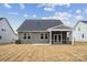 Gray house with screened porch and grassy backyard at 3209 Whispering Creek Dr, Indian Trail, NC 28079