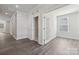 Interior hallway with light gray walls and wood flooring at 3209 Whispering Creek Dr, Indian Trail, NC 28079