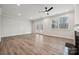 Living room with wood floors and French doors to backyard at 3209 Whispering Creek Dr, Indian Trail, NC 28079