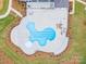 Aerial view of a resort-style pool with surrounding lounge chairs at 3209 Whispering Creek Dr, Indian Trail, NC 28079