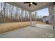 Screened porch with concrete flooring and wooded view at 3209 Whispering Creek Dr, Indian Trail, NC 28079